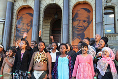 Children sing songs in celebration of former President Nelson Mandela at Parliament